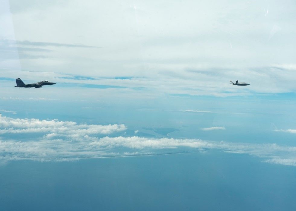 F-15SE Silent Eagle and XQ-58A in formation TurDef.jpg